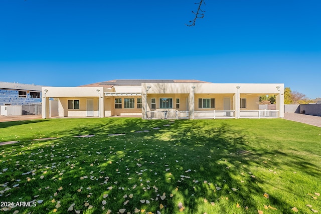 rear view of property featuring a pergola, a lawn, and central AC unit