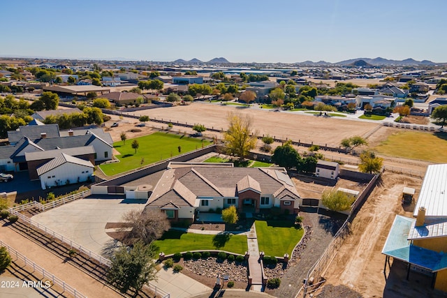 birds eye view of property with a mountain view