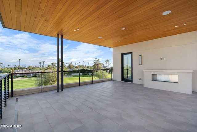 view of patio featuring a balcony