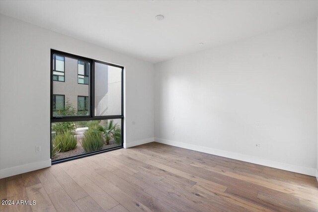 6311 E Phoenician Blvd Unit 21, Scottsdale, AZ 85251 - unfurnished room featuring wood finished floors and baseboards