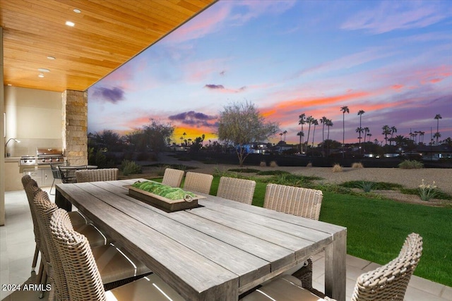 patio terrace at dusk with grilling area