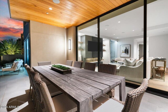 6311 E Phoenician Blvd Unit 21, Scottsdale, AZ 85251 - dining space featuring a wall of windows and wood ceiling