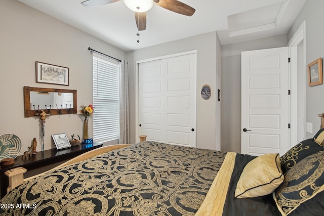 bedroom with ceiling fan and a closet