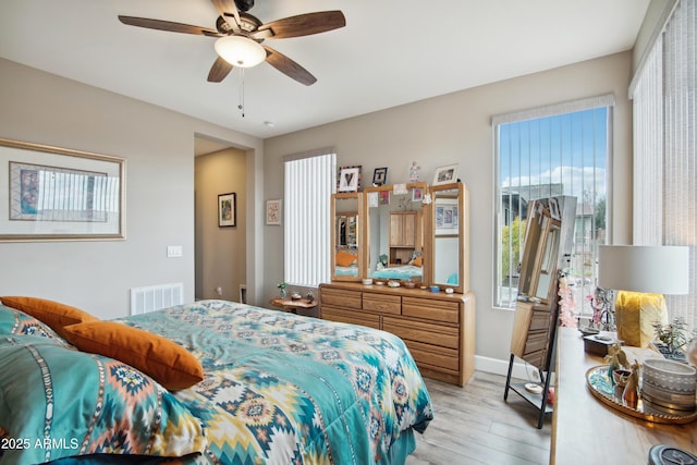 bedroom featuring ceiling fan and light hardwood / wood-style floors