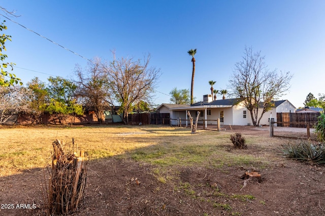 view of yard with a fenced backyard