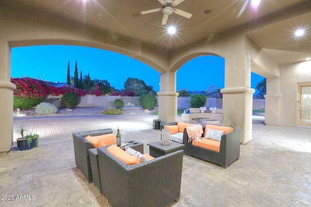 view of patio / terrace featuring fence, a ceiling fan, and an outdoor hangout area