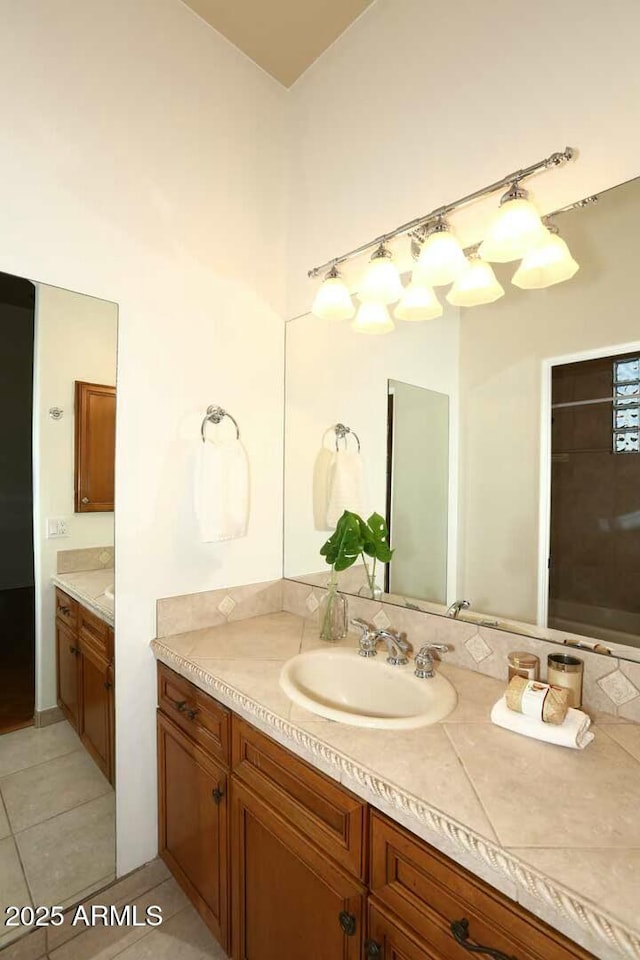 bathroom with tile patterned floors and vanity