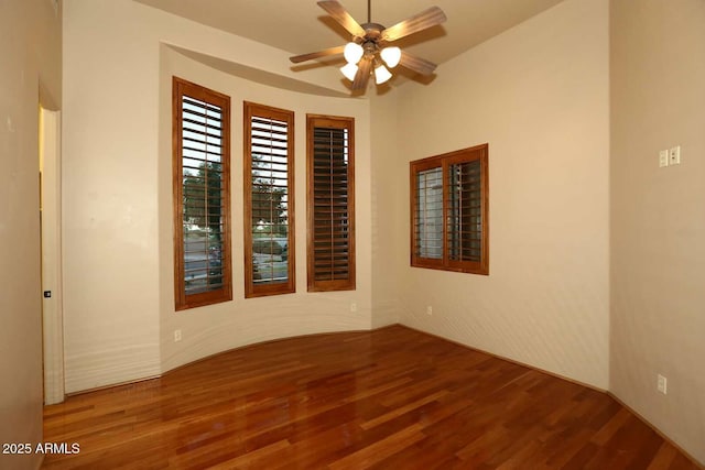 spare room featuring wood finished floors and ceiling fan