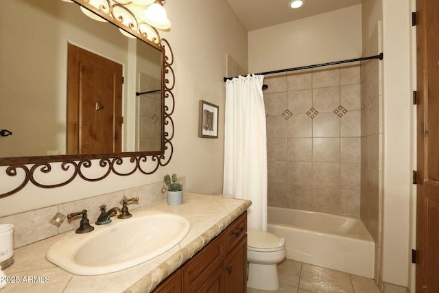bathroom with toilet, shower / bath combo, vanity, and tile patterned flooring