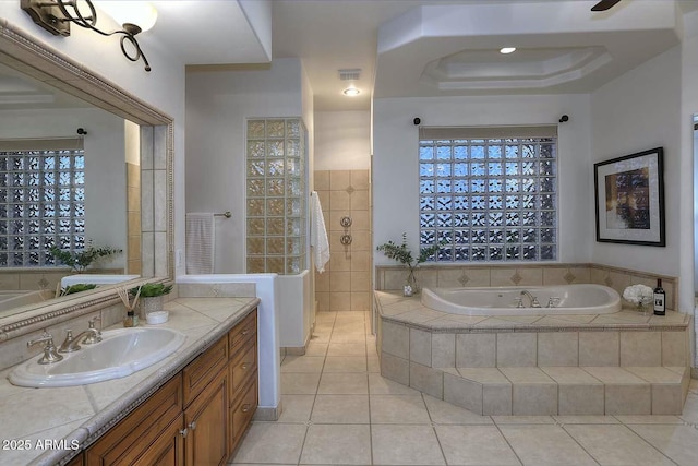 full bathroom with a bath, a walk in shower, vanity, and tile patterned flooring