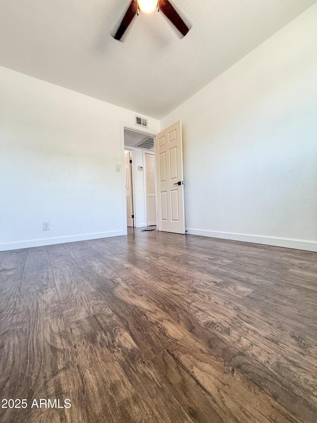 8445 S 7th Ave, Phoenix, AZ 85041 - unfurnished room with ceiling fan, dark wood finished floors, and baseboards