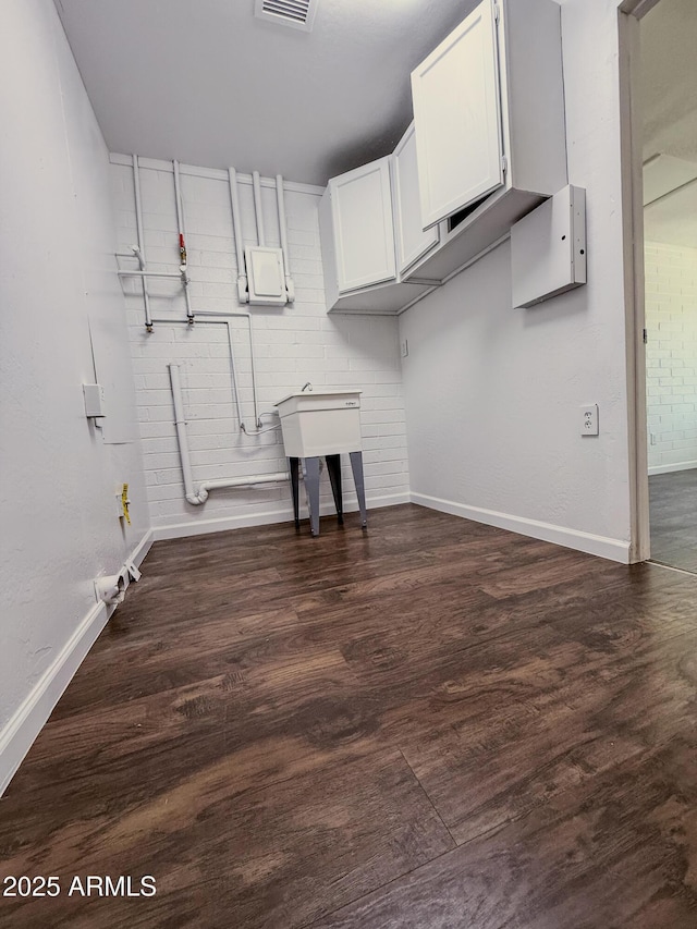 8445 S 7th Ave, Phoenix, AZ 85041 - basement featuring baseboards and dark wood finished floors