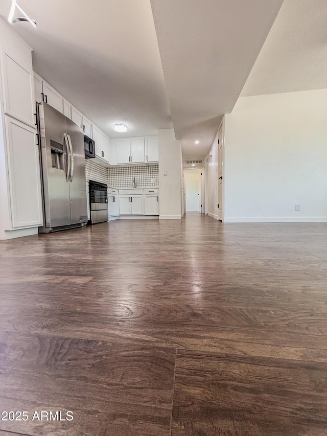 8445 S 7th Ave, Phoenix, AZ 85041 - unfurnished living room with baseboards, dark wood finished floors, and a sink