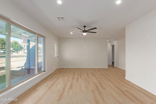 unfurnished room featuring ceiling fan and light hardwood / wood-style flooring