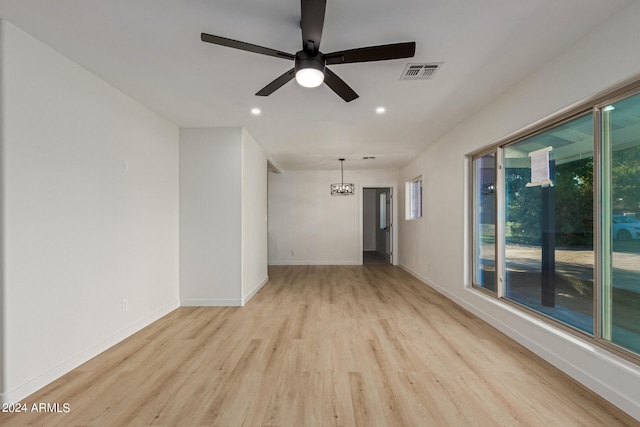 empty room with light hardwood / wood-style floors and ceiling fan