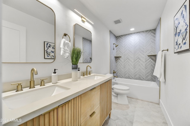 full bathroom featuring visible vents, a sink, bathing tub / shower combination, and toilet