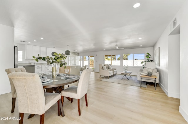 dining room featuring baseboards, recessed lighting, visible vents, and light wood-style floors