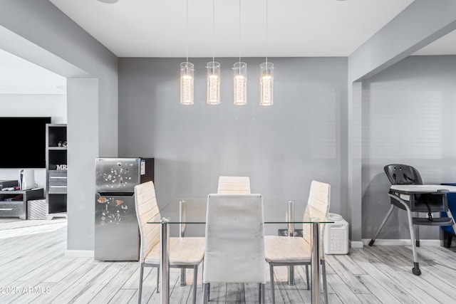 dining area with hardwood / wood-style floors