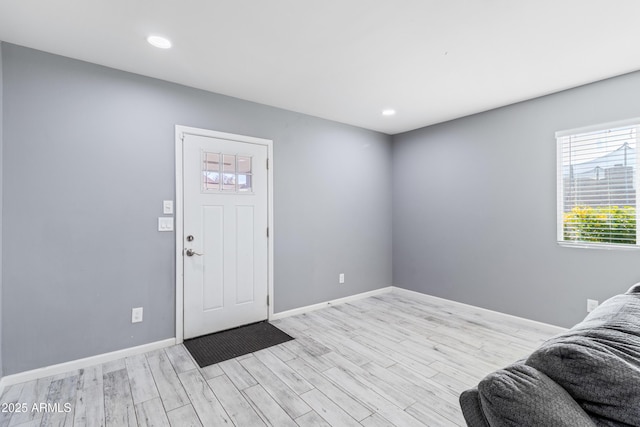 entrance foyer with light hardwood / wood-style flooring