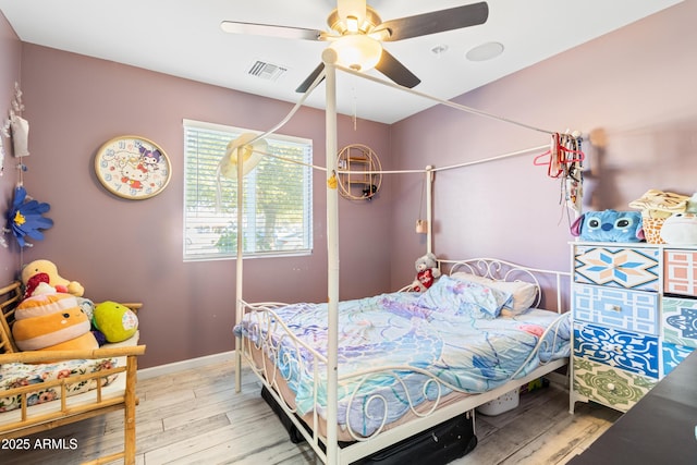 bedroom featuring ceiling fan and light hardwood / wood-style flooring