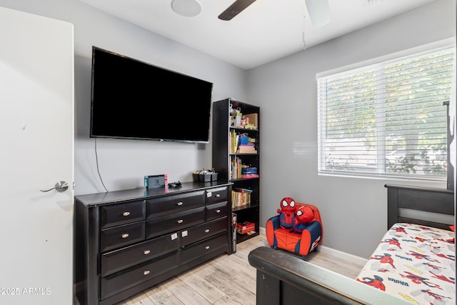 bedroom featuring light hardwood / wood-style flooring and ceiling fan