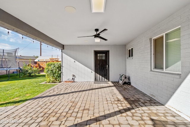 view of patio / terrace featuring a trampoline and ceiling fan