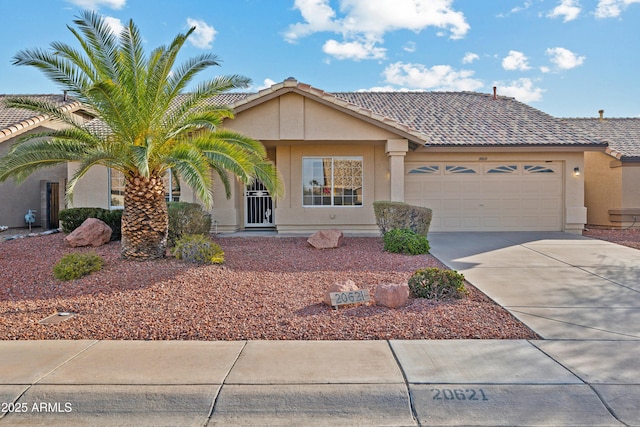 ranch-style house featuring a garage