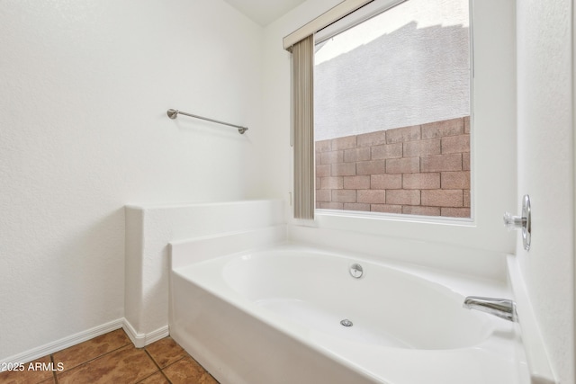 bathroom featuring tile patterned floors and a bathing tub