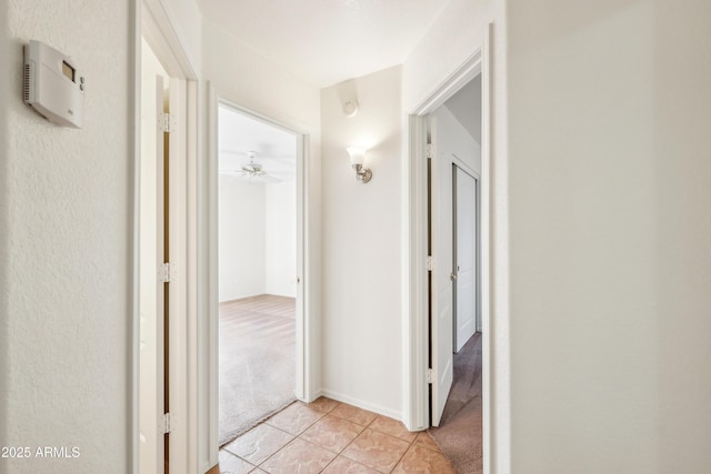 hallway with light carpet