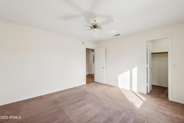 unfurnished room with light carpet and ceiling fan