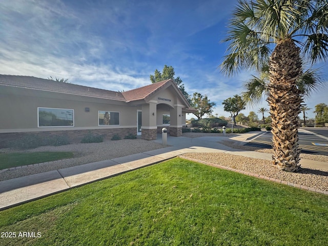 view of front of home with a front yard