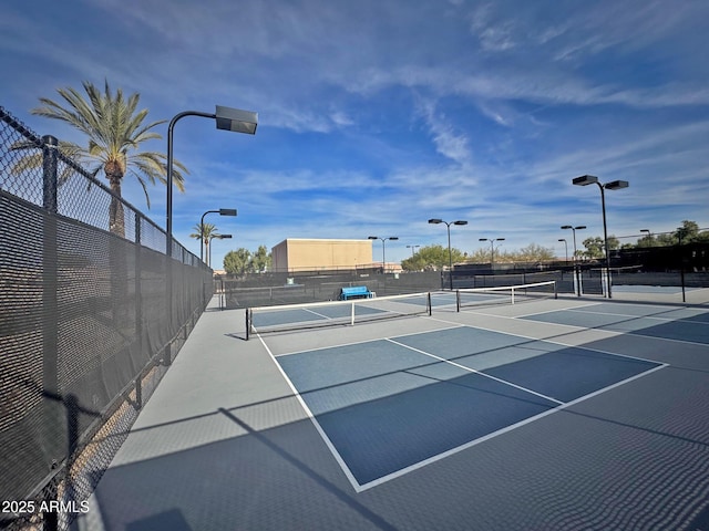 view of sport court with basketball hoop