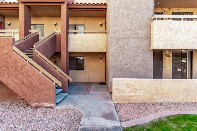 entrance to property with a balcony