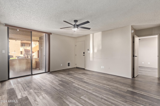 spare room featuring ceiling fan, hardwood / wood-style floors, and a textured ceiling