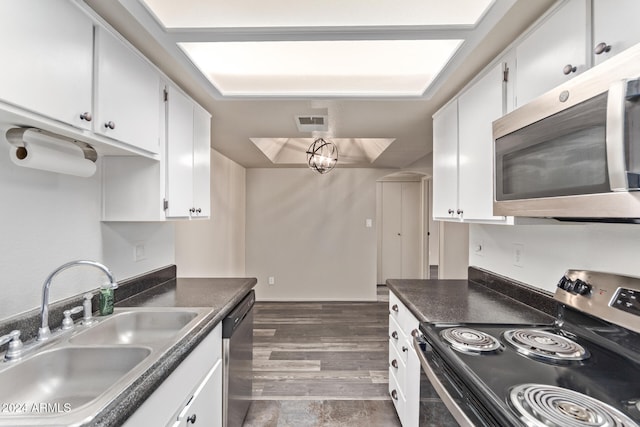 kitchen featuring sink, white cabinets, dark wood-type flooring, and appliances with stainless steel finishes