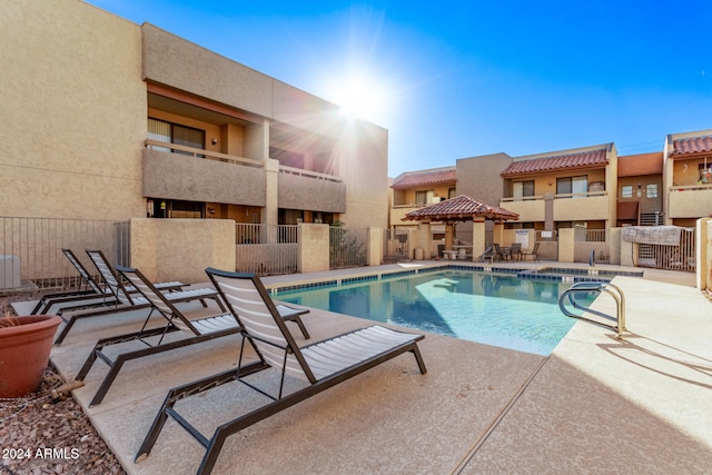 view of swimming pool with a patio