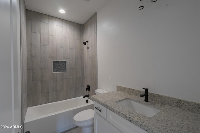 full bathroom with tiled shower / bath combo, vanity, and toilet