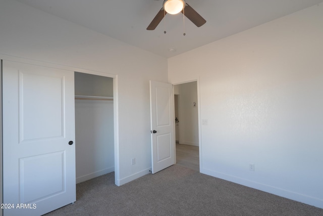 unfurnished bedroom featuring ceiling fan, a closet, and carpet flooring