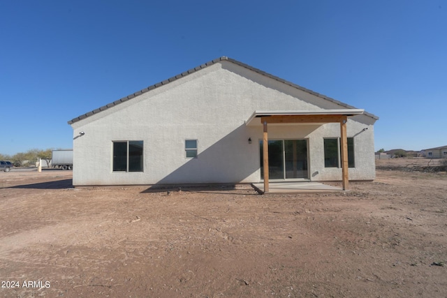 back of property with a patio area