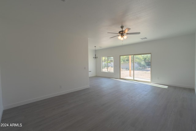 spare room with dark hardwood / wood-style floors and ceiling fan