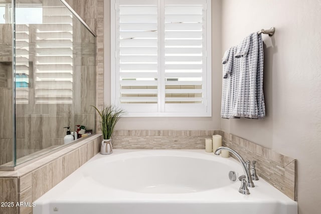 bathroom with a garden tub