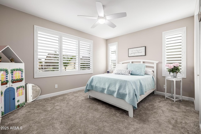 carpeted bedroom with a ceiling fan and baseboards