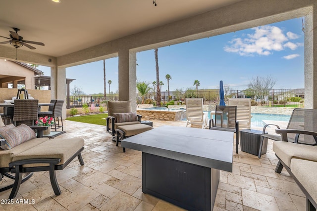 view of patio featuring ceiling fan, outdoor lounge area, a fenced backyard, and a fenced in pool