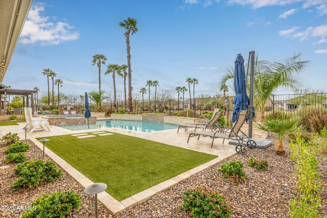 view of swimming pool with a fenced in pool, a patio area, a yard, and fence