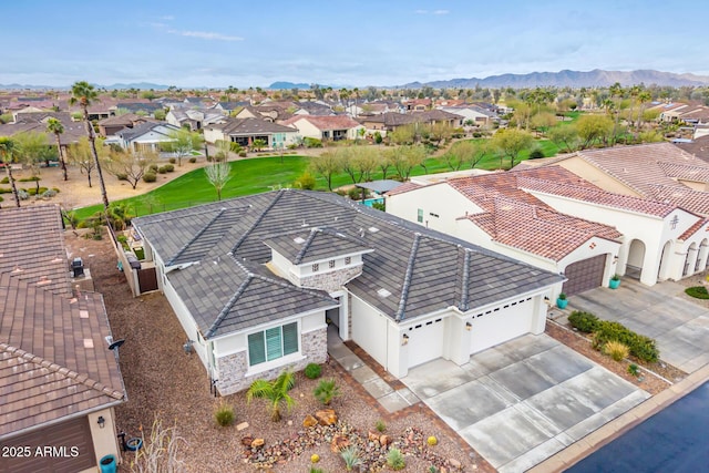 drone / aerial view featuring a residential view and a mountain view