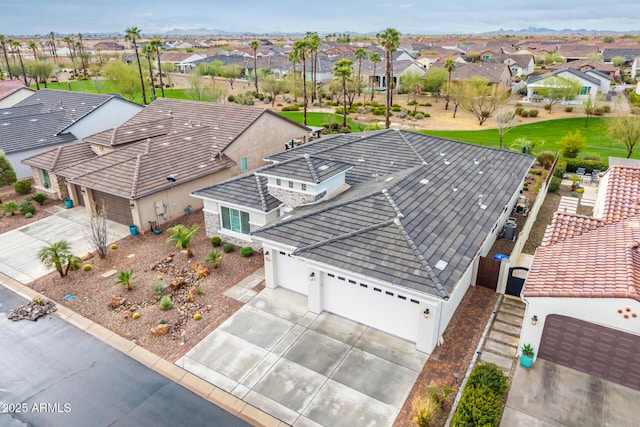 birds eye view of property with a residential view