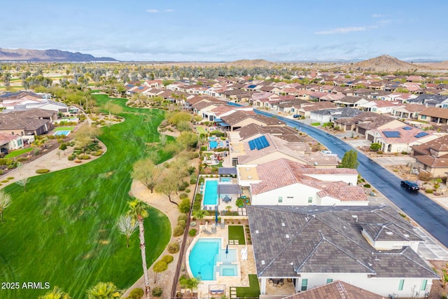 drone / aerial view featuring a residential view and a mountain view