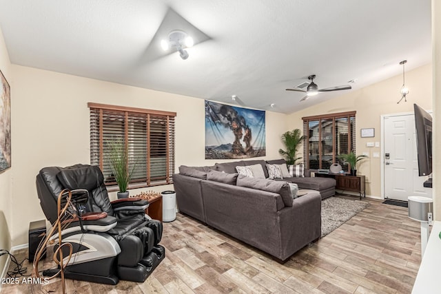 2108 E Patrick Ln, Phoenix, AZ 85024 - living room with light wood-type flooring, lofted ceiling, and a ceiling fan