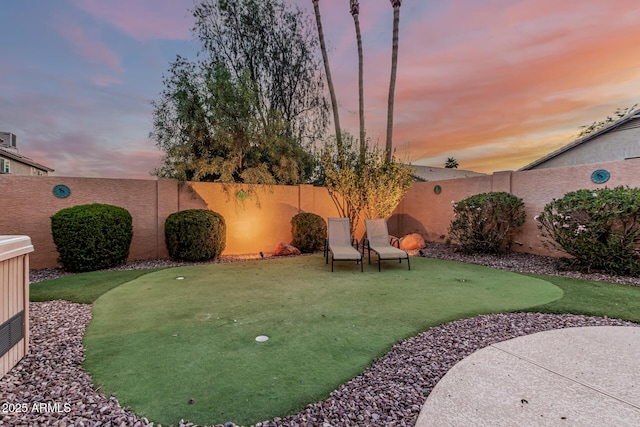 2108 E Patrick Ln, Phoenix, AZ 85024 - yard at dusk with a putting area and a fenced backyard