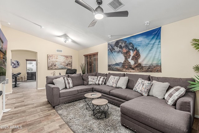 2108 E Patrick Ln, Phoenix, AZ 85024 - living area with light wood-type flooring, vaulted ceiling, a ceiling fan, and arched walkways
